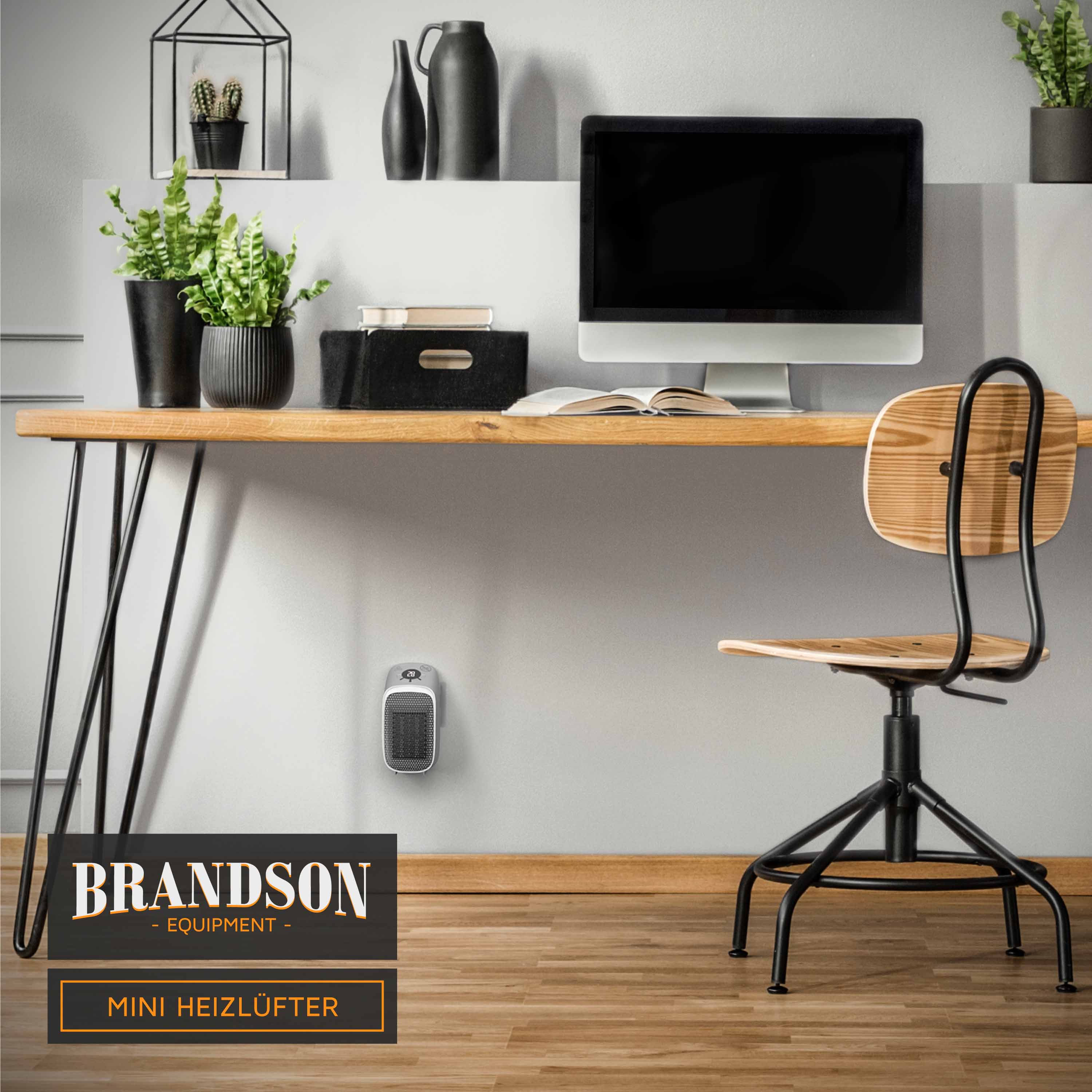 Brandson Mini Heizlüfter im modernen Design, kompakt und platzsparend, auf einem Holzfußboden neben einem Schreibtisch.