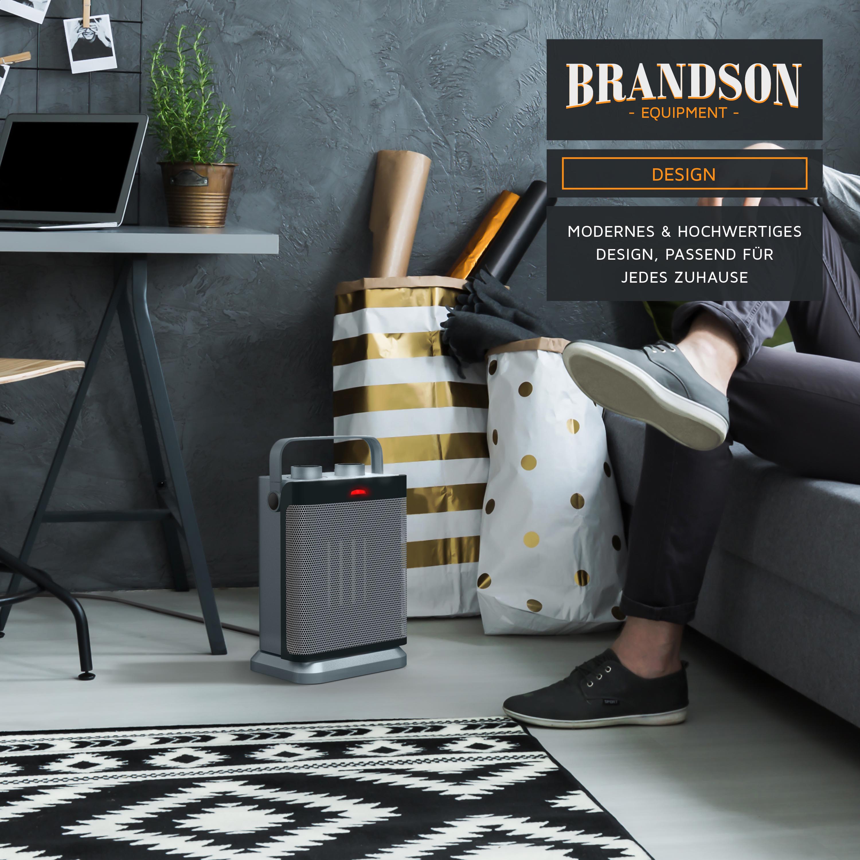 Brandson Heizlüfter in modernem Design, graue Farbe, mit Bedienfeld und Tragegriff, platziert neben einem Sofa und Dekoration.