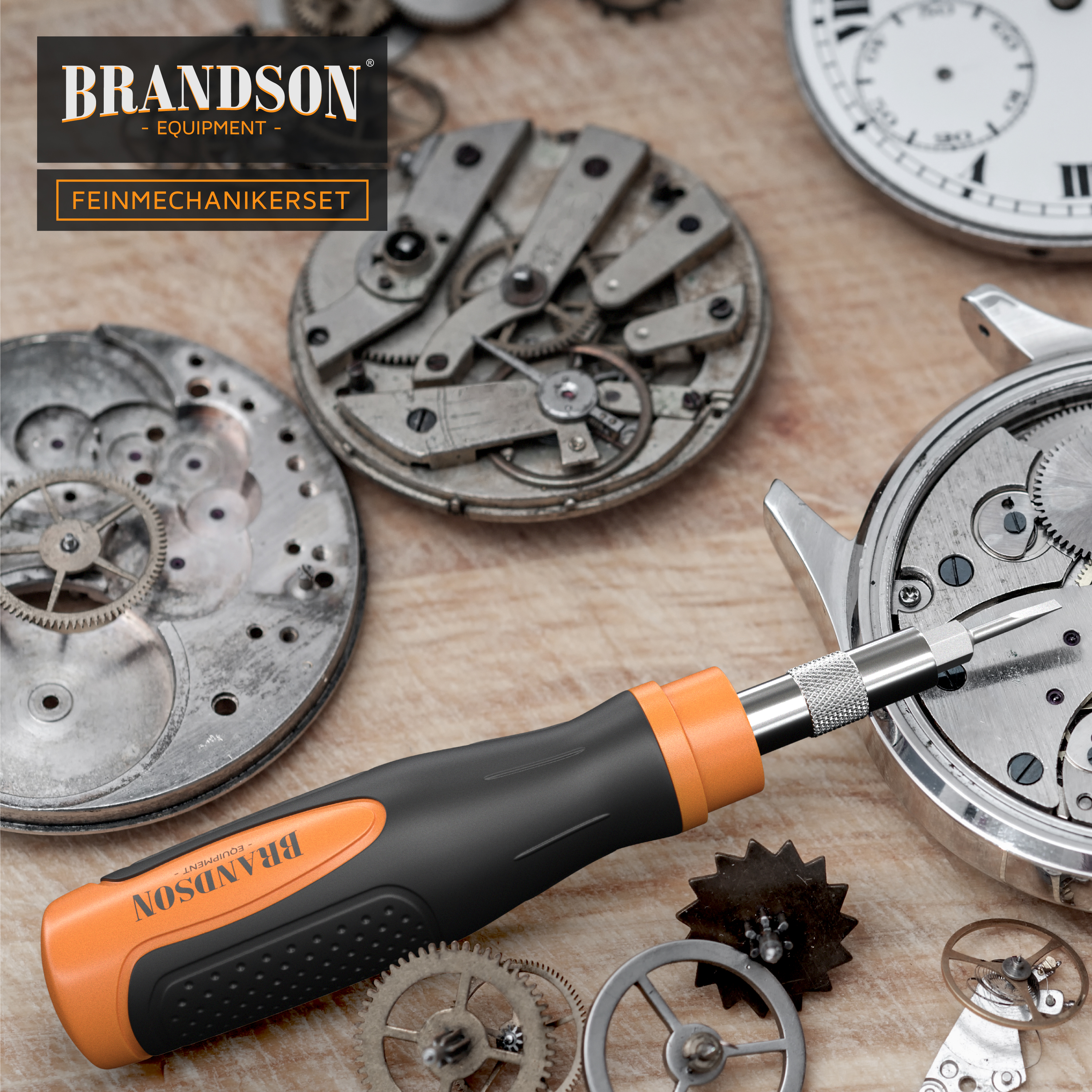Brandson Feinmechanikerset mit ergonomischem Griff in Schwarz und Orange, umgeben von Uhrenmechanik und Zahnrädern auf Holzuntergrund.