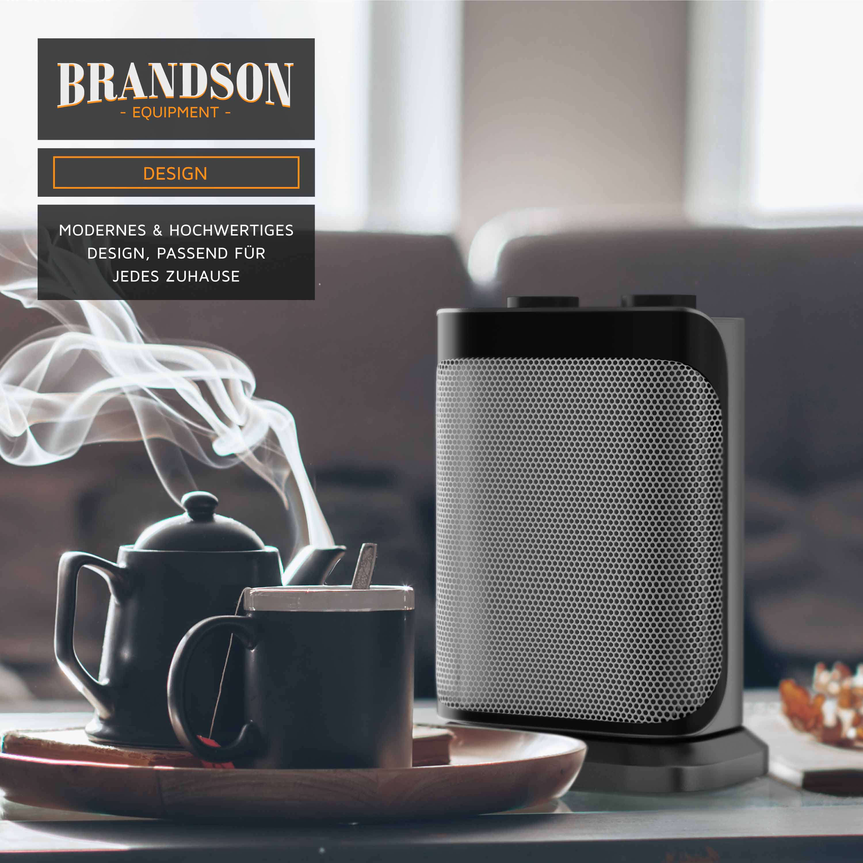 Brandson Heizlüfter im modernen Design, schwarz mit runder Basis und perforierter Front, platziert auf einem Tisch neben einer Teekanne und Tasse.